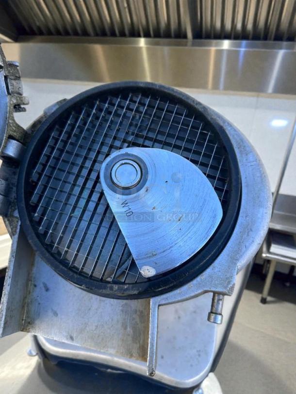 Globe GFP-500 commercial food processor in excellent condition, showcasing metal grid and blade. NSF & UL rated, 115V, fully tested.