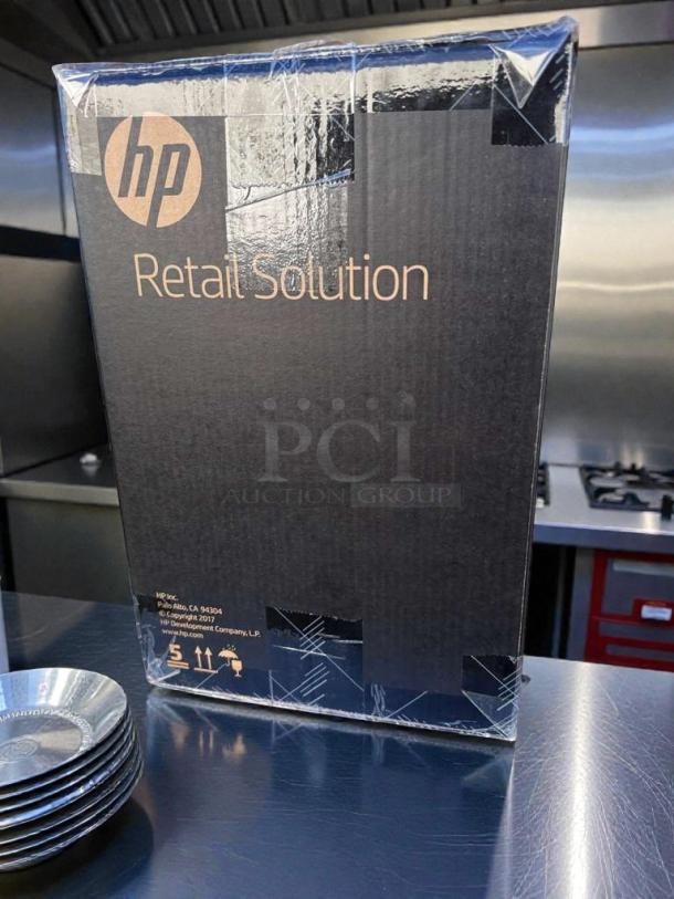 Brand new HP Engage One AIO POS System Model 145 in sealed original box. UL Listed. Retail Solution packaging visible.