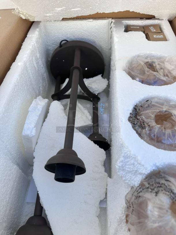 Brand new Zuomor Jump Table Lamp set in original box, featuring 3-light rustic amber glass. Model ZUO-S-LMP-0297.