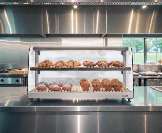 Brand new KoolMore DC-53C-B countertop bakery display case with curved glass, never used, in original crate.