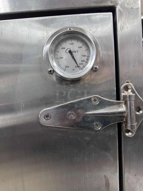 Commercial stainless steel smoker cabinet with temperature gauge, premium condition, NSF certified, by Atlanta Culinary Equipment.