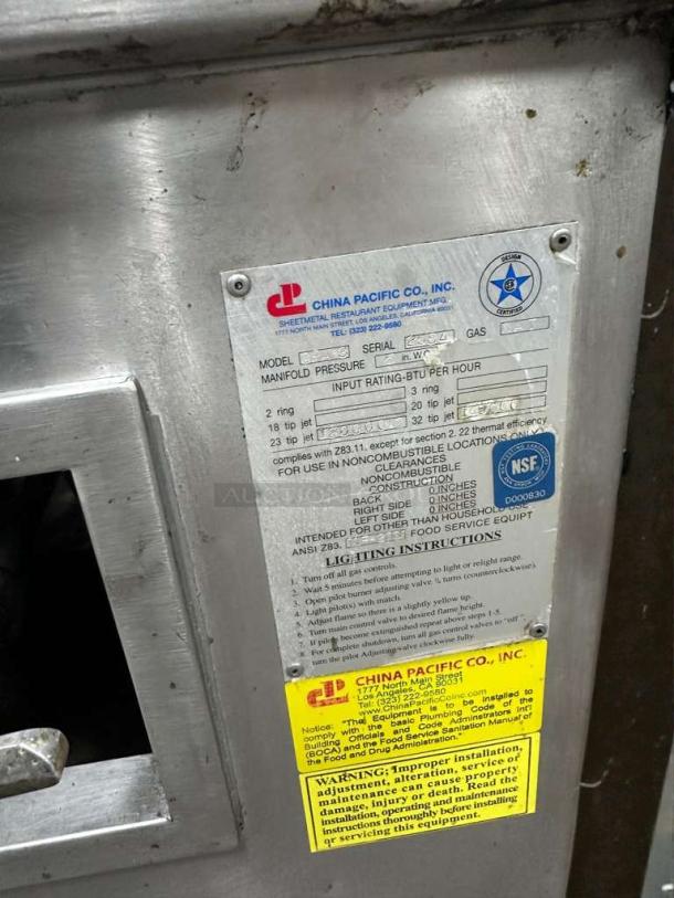 China Pacific Commercial Gas Wok Range label showing model CP-L-RNG-0320, NSF certified, 3-ring burners, operational status.