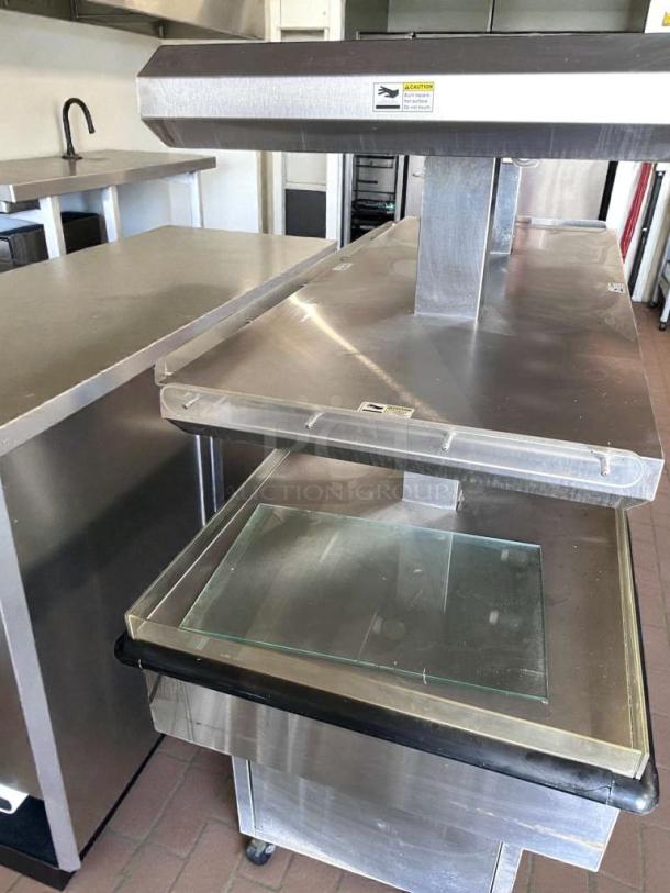Royston 72" Heated Hot Food Island, stainless steel, NSF certified, fully operational, excellent condition, with safety labels.