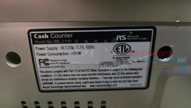 Royal Sovereign RBC-2100 cash counter label showing model, power details, and compliance marks.