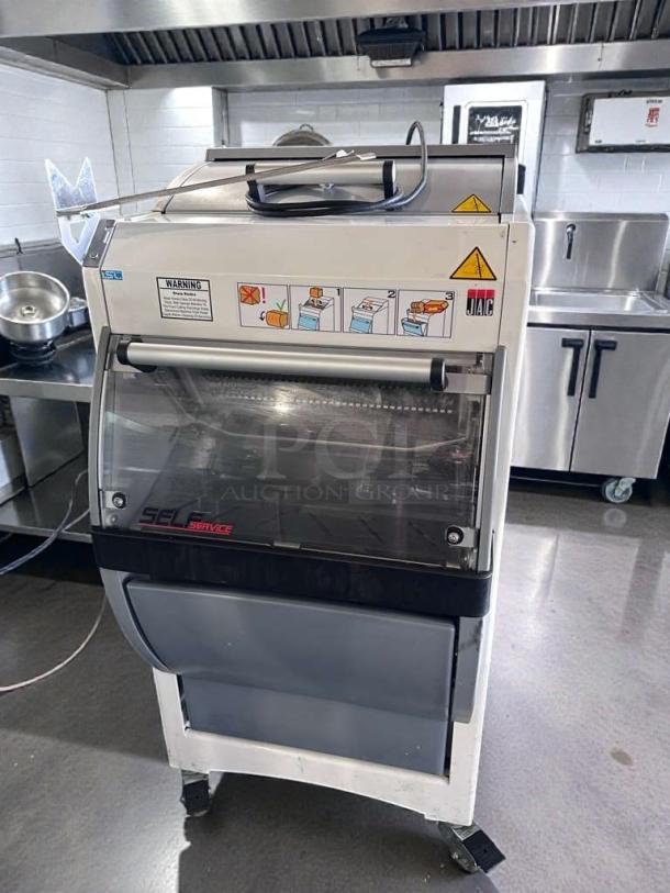JAC SFN 450/12 commercial bread slicer, 12mm slice, UL listed, tested, operational, with illustrated safety instructions visible.