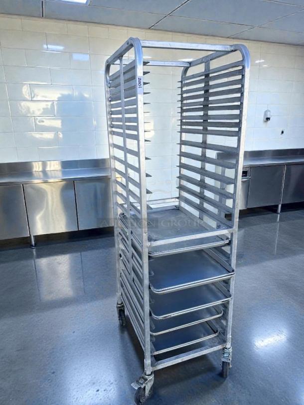 Heavy-duty 20-tier commercial aluminum bakery sheet pan rack in superior condition. Mobile with inspection label visible.