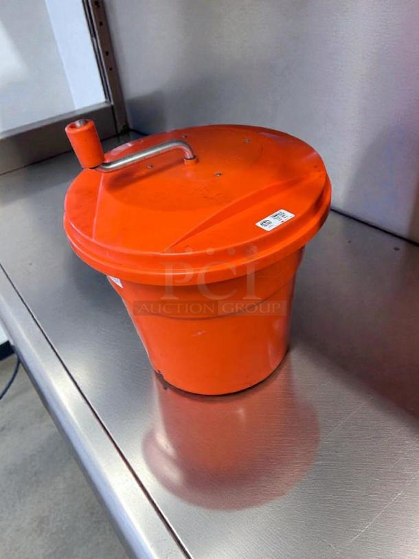 NSF certified orange utility container with lid and drain valve, in good condition. Features include a sturdy handle. Model CFG-S-CONT-0365.