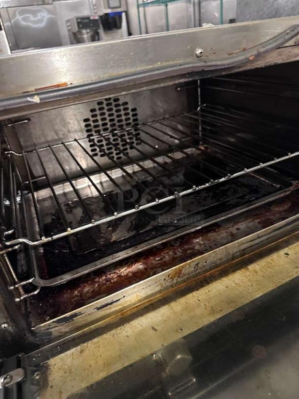 Cadco OV-013 / XAF-013-US convection oven, commercial countertop model, stainless steel, interior view, fully operational.