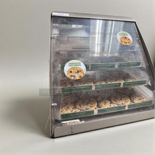 Commercial countertop bakery display case in stainless steel, multi-tier design, excellent condition, showcases cookies.