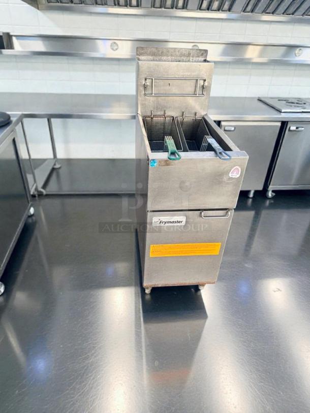 Pristine Frymaster 1ESG35T gas floor fryer, natural gas, fully tested. Features dual baskets, stainless steel body, and Frymaster branding.