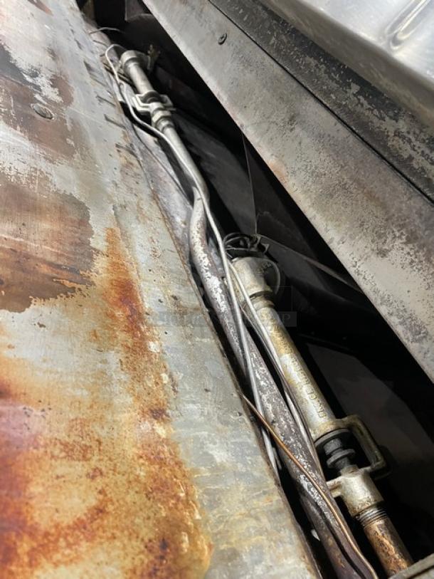 Bari commercial pizza oven model M648M, stainless steel, gas-powered, signs of rust, includes stones, serial number 2621, on legs.