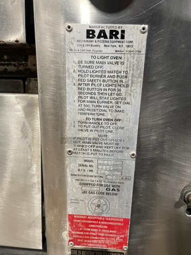 Bari stainless steel gas pizza deck oven, model M648M, single stacked with stones, serial number 2621, on legs.