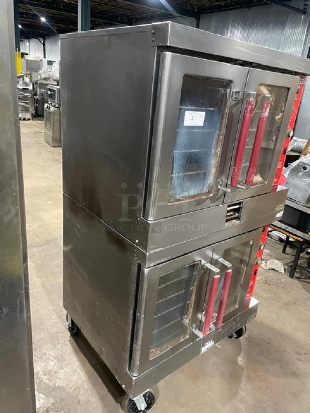Vulcan VC4GD-SEFCCC stainless steel gas convection oven, double-stacked, with wired rack, on casters, visible wear.