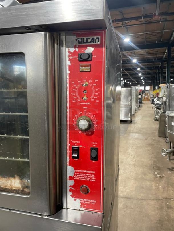 Vulcan commercial stainless steel gas convection oven, Model VC4GDSEFCCC. Features control panel, wired rack, on casters.