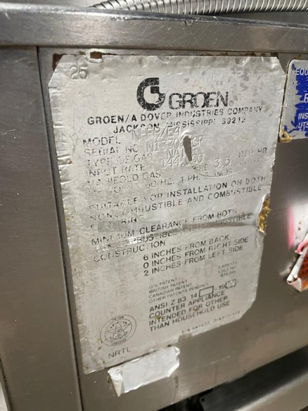 Groen stainless steel 40-gal. tilt skillet, natural gas, model NHFP/E4, features single spout faucet, on legs, visible wear.