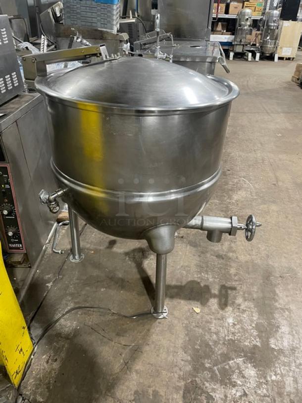 Groen FT-80 stainless steel 80-gallon direct steam kettle, 2/3 jacketed, tri-leg base, model FT80, serial 72285, on legs.