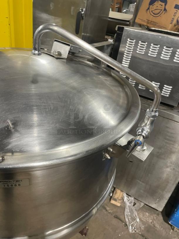 Groen FT80 80-gal stainless steel kettle with tri-leg base, direct steam, lid, and piping. Serial number 72285, on legs.