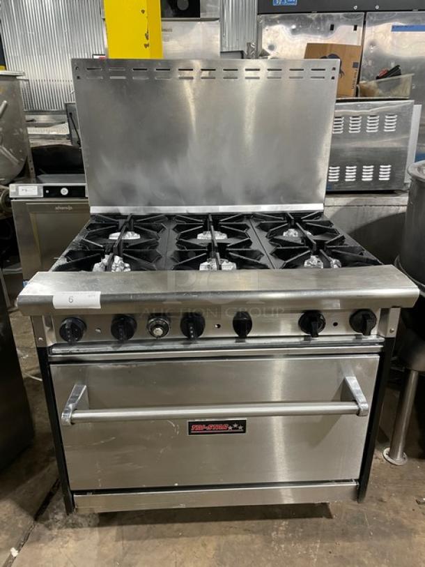 Tri-Star commercial stainless steel 6-burner gas range/oven combo with backsplash, wired oven rack, on legs. Excellent condition.