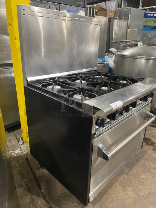 Tri-Star stainless steel 6-burner gas range/oven combo with backsplash, wired oven rack, and legs. Commercial-grade condition.