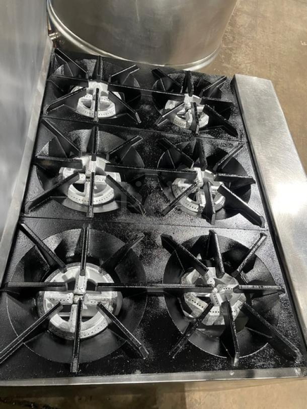Tri-Star stainless steel 6-burner gas range/oven combo with backsplash and wired oven rack. Sturdy legs, excellent condition.