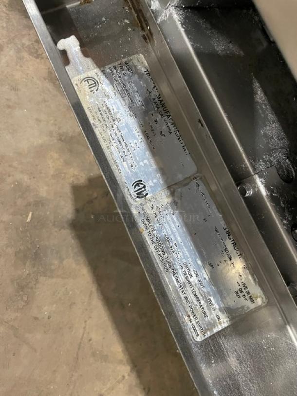 Tri-Star commercial stainless steel 6-burner gas range/oven, includes backsplash, wired rack, on legs; labels show model info.