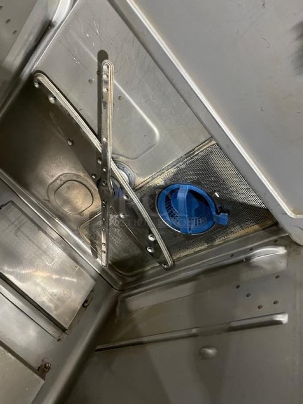 Hobart Advansys LXNR undercounter dishwasher interior, stainless steel finish, visible spray arm, Energy Star certified.