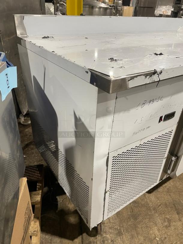 Custom Cool LB93 3-door refrigerated worktop table, stainless steel, 93" with up-turned backsplash, pan rack, on casters.