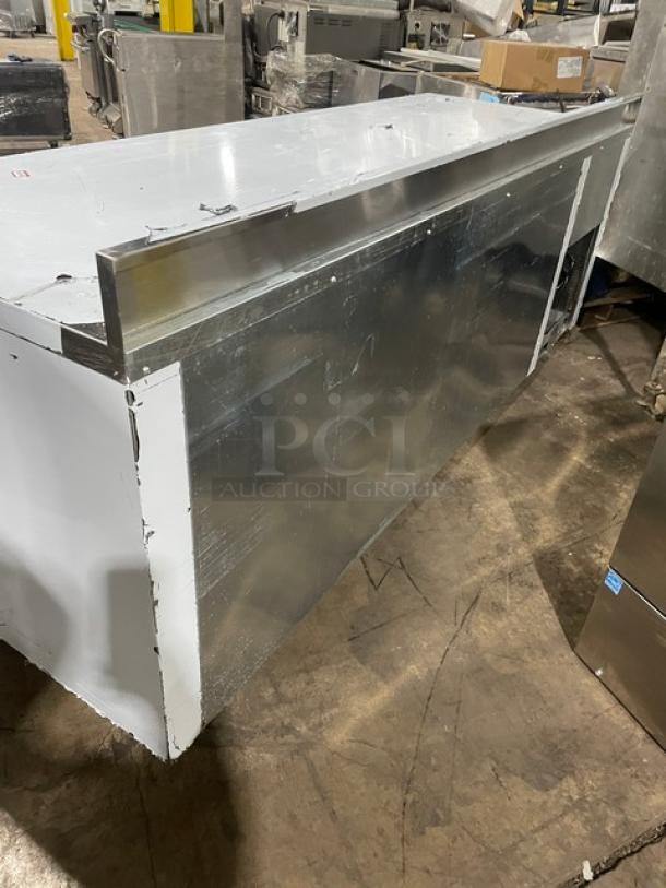 Custom Cool LB93 refrigerated worktop table, 93" stainless steel, 3 doors, up-turned backsplash, pan rack, on casters.