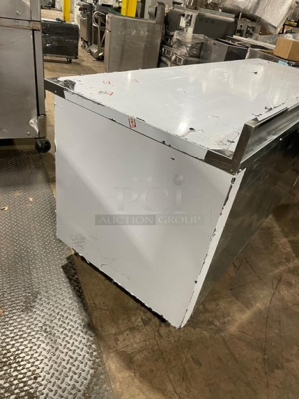 Custom Cool 93" stainless steel refrigerated worktop table, model LB93. Features up-turned backsplash, pan rack, on casters.