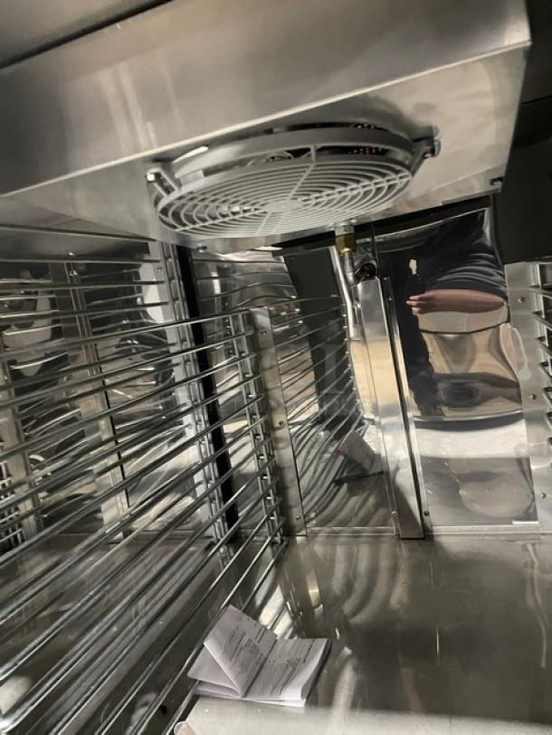 Custom Cool LB93 stainless steel 3-door refrigerated worktop table interior showing up-turned back splash and built-in pan rack.