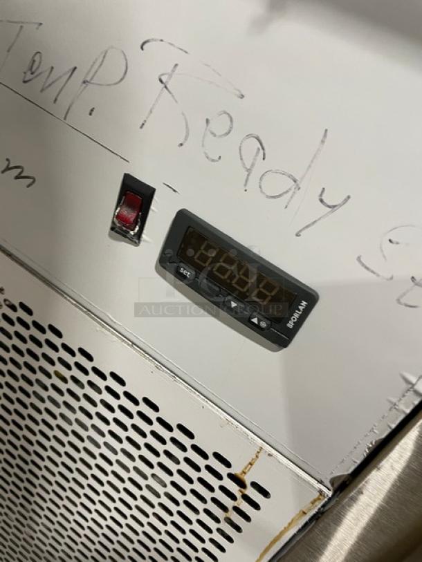 Custom Cool LB93 refrigerated worktop table, stainless steel, 3 doors, built-in pan rack, up-turned backsplash, on casters.