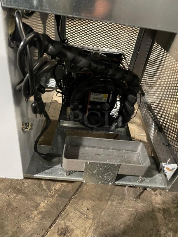 Custom Cool LB93 refrigerated worktop table, stainless steel, 3-door, upturned backsplash, pan rack, visible wiring.