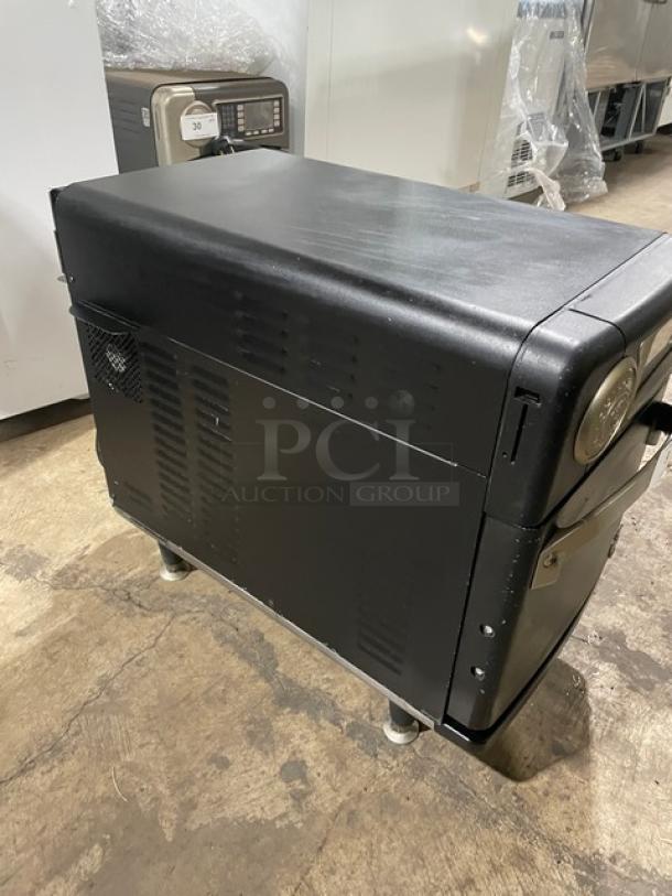 TurboChef black electric countertop rapid cook oven, model NGO, ventless, 2021, with crank bar. Good condition on legs.