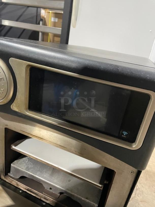 TurboChef Model NGO ventless rapid cook oven, 2021, black, countertop design, with crank bar, 208/240V, 1 phase, on legs.