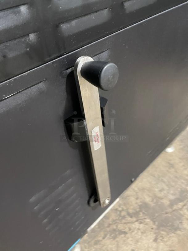 TurboChef NGO ventless rapid cook oven, black, with crank bar, late 2021 model, electric, countertop edition, on legs.