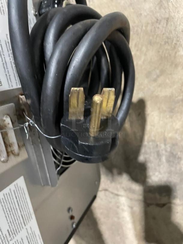 TurboChef NGO commercial countertop oven plug detail, 208/240V, black electric powered, ventless rapid cook, model NGO.