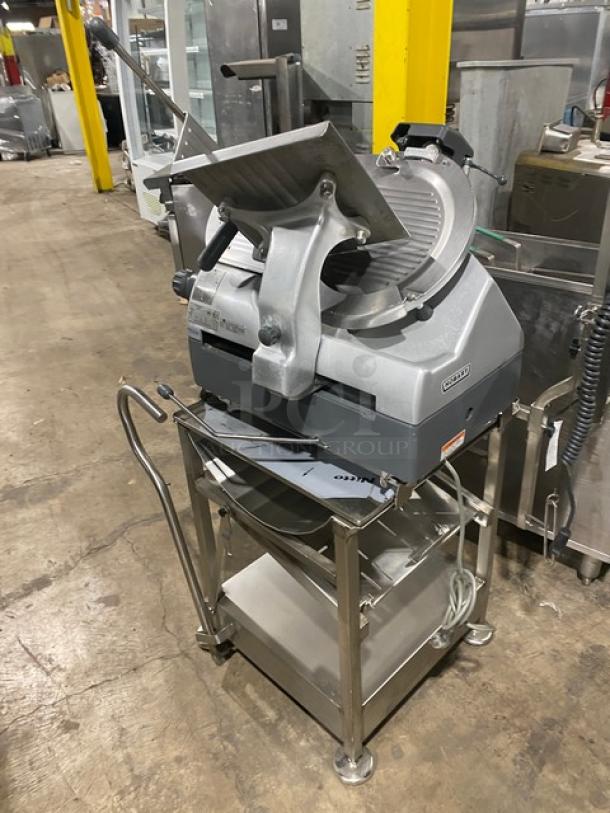 Hobart Model 2912 deli meat slicer on a new Deli Buddy cart. Electric-powered, heavy-duty, on legs and casters.