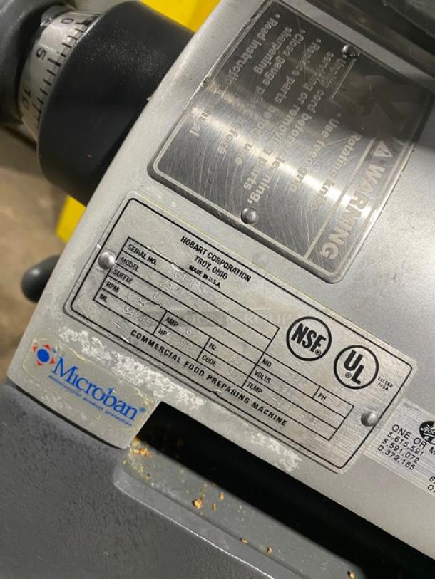 Hobart Model 2912 deli slicer with brand tags; NSF and UL certified; includes serial number plate and Microban label.