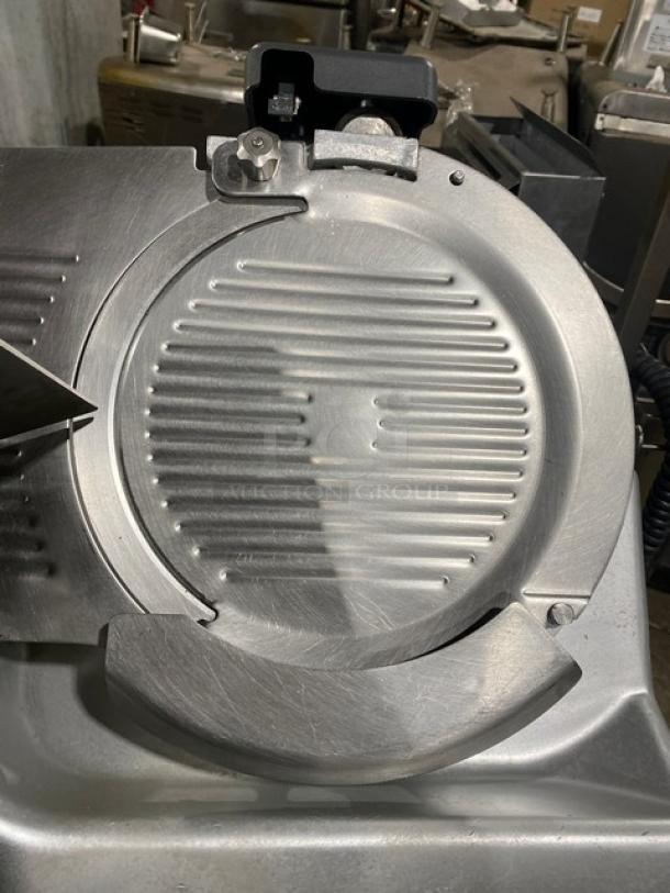 Hobart 2912 electric deli meat slicer on legs and casters, with a brand new Deli Buddy undershelf cart. Used condition.