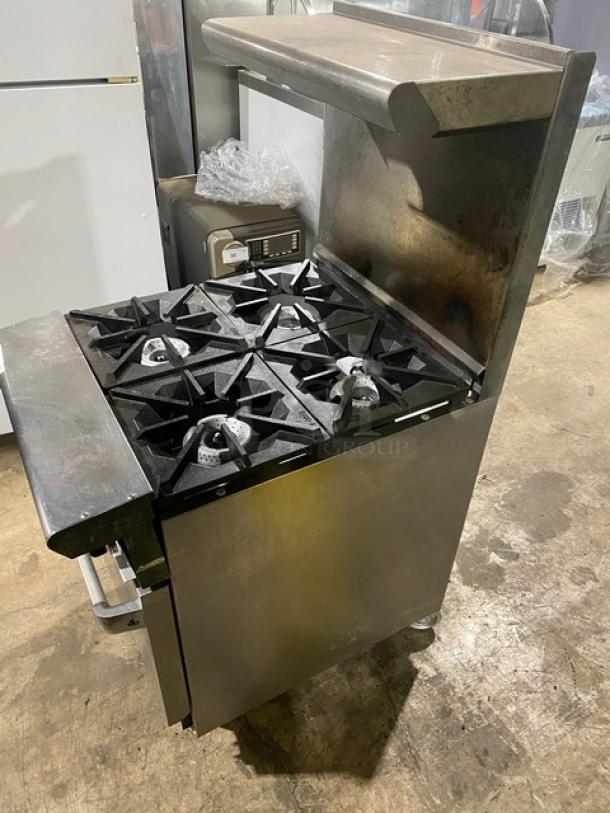 American Range stainless steel 4-burner gas range/oven combo with backsplash, overhead salamander shelf, and wired oven rack.