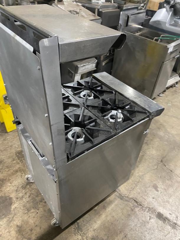 American Range 4-burner gas range/oven combo, stainless steel, with backsplash, overhead salamander shelf, and casters.