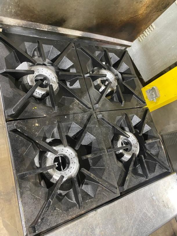 American Range commercial stainless steel 4-burner gas range/oven combo with backsplash, overhead salamander shelf, and casters.