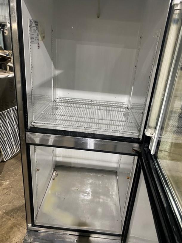 True T231G1 commercial stainless steel reach-in refrigerator, combo glass/solid half-doors, poly coated wire rack, model T-23-1-G-1, SN: 8070067, 115V 1 Phase, in clean condition.
