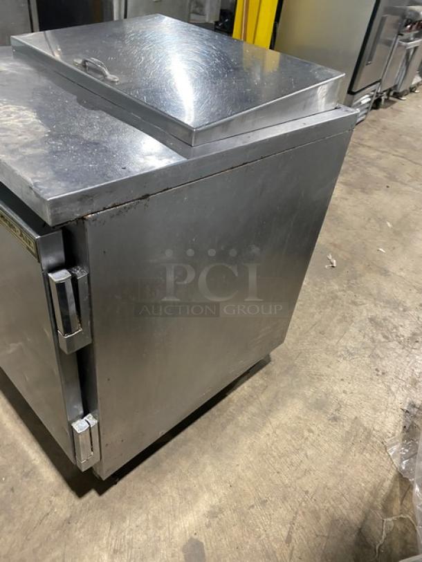 Beverage-Air SP27 stainless steel refrigerated prep table with single door, poly-coated rack, on casters, model SN: 8108534.