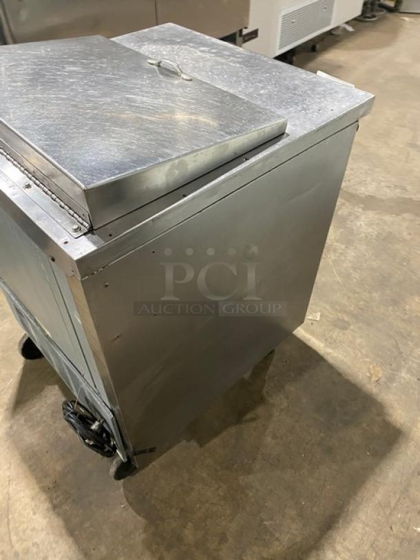 Beverage-Air SP27 stainless steel refrigerated prep table, single door, poly-coated rack, on casters, model SN: 8108534.
