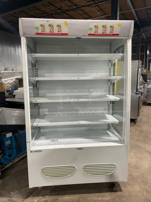 Beverage-Air MB13US white refrigerated merchandiser display case with adjustable shelving, open front, model number visible.