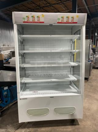 Beverage-Air MB13US white refrigerated merchandiser display case with adjustable shelving, open front, model number visible.