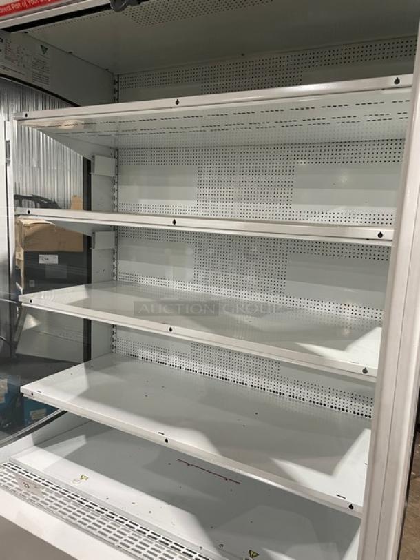 Beverage-Air Model MB13US commercial white refrigerated merchandiser display case with adjustable multi-tier shelving.