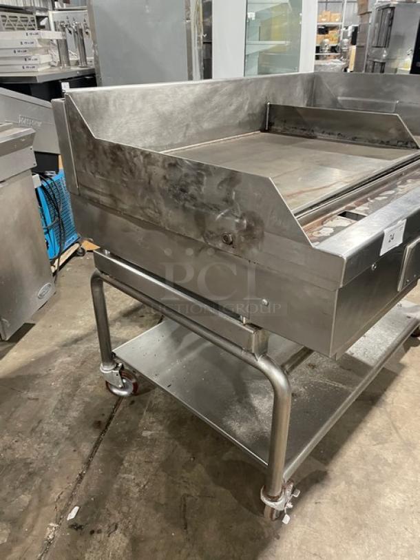 WoodStone 48" stainless steel plancha flat griddle on casters, with back and side splash, and undershelf cart, SN: GP1B16MAY1704992.