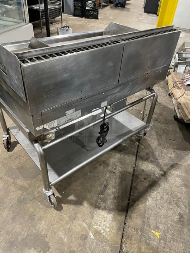 WoodStone 48" stainless steel gas griddle with back and side splash, undershelf cart on casters, SN: GP1B16MAY1704992.